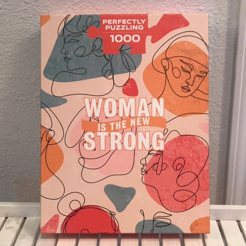 Perfectly Puzzling 1000 piece “Woman is the New Strong” puzzle. New in box.